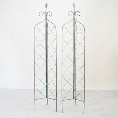 Lot 124 - A pair of metal lattice folding garden spires,...