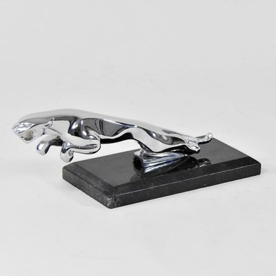 Lot 655 - A model of a jaguar, on a granite base, 20cm