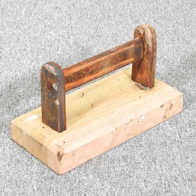 Lot 605 - A metal bootscraper, on a sandstone base, 29cm