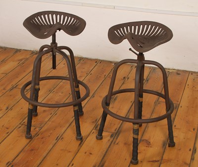 Lot 461 - A pair of metal tractor seat bar stools