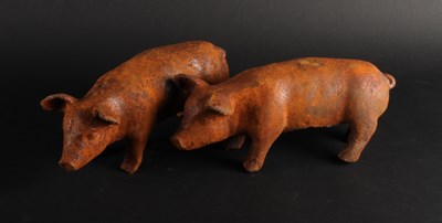 Lot 394 - A pair of small rusted metal models of pigs