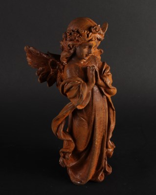 Lot 299 - A rusted metal model of an angel, praying