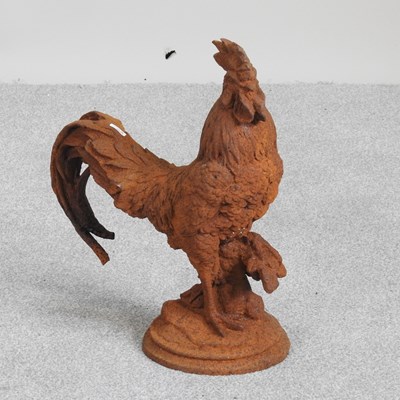 Lot 613 - A rusted metal garden statue of a cockerel,...