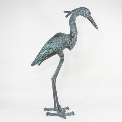 Lot 556 - A verdigris cast metal garden statue of a...
