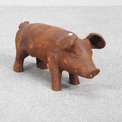 Lot 400 - A rusted metal garden statue of a pig, 19cm high
