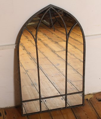 Lot 665 - A small metal framed gothic arched mirror