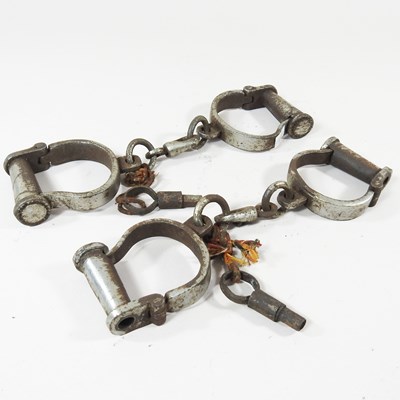 Lot 512 - Two pairs of metal handcuffs (2)