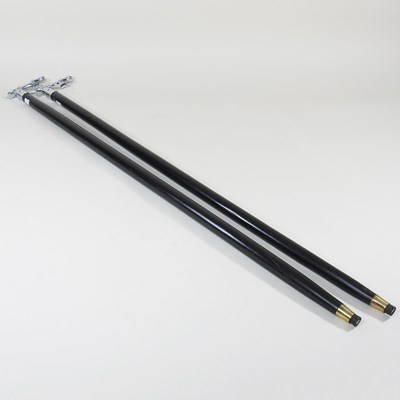 Lot 539 - Two modern walking sticks, each with a handle...