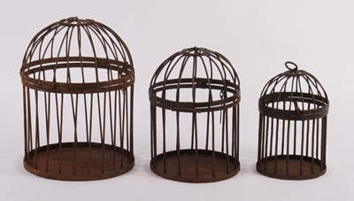 Lot 286 - Three graduated metal bird cages