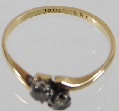 Lot 77 - An 18 carat gold two stone diamond ring