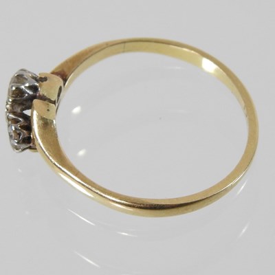 Lot 77 - An 18 carat gold two stone diamond ring