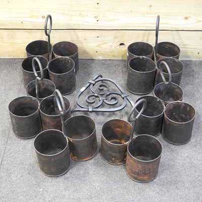 Lot 283 - A set of three metal spice carriers, together...