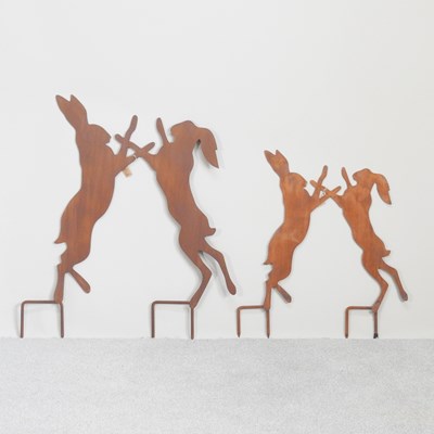 Lot 150 - A rusted garden model of fighting hares, 86cm...