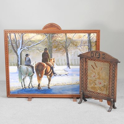 Lot 559 - An early 20th century oak firescreen, of large...