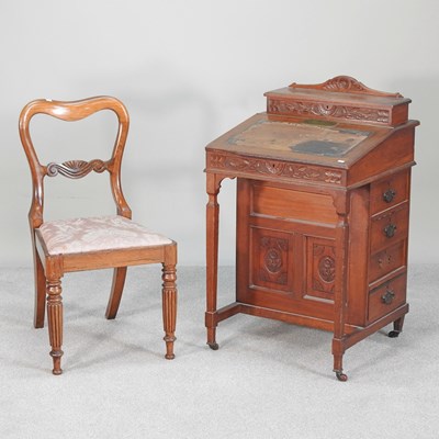 Lot 580 - A Victorian davenport, with presentation...