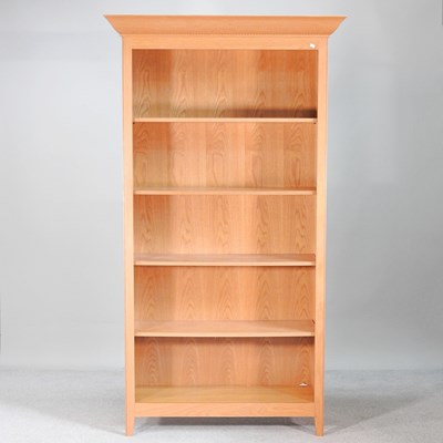 Lot 664 - A modern light oak standing open bookcase