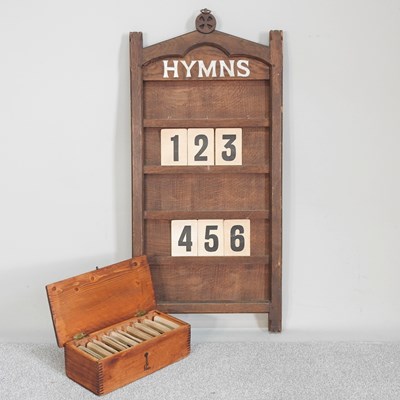 Lot 163 - An early 20th century oak ecclesiastical hymn...