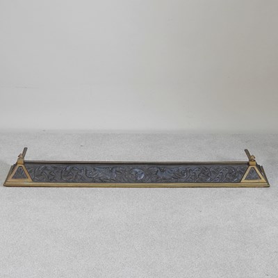 Lot 403 - A Welsh brass and iron fender, relief...