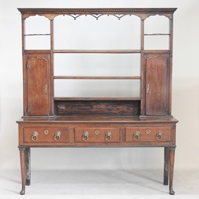 Lot 199 - An 18th century oak dresser, the open plate...