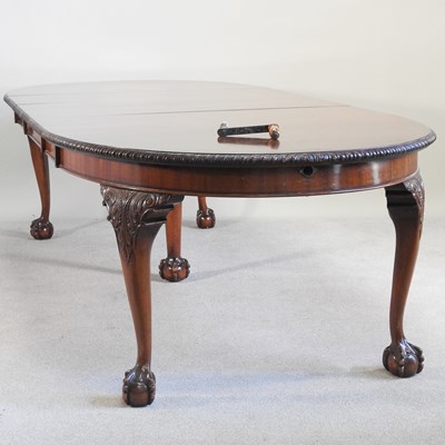 Lot 614 - A large 1920s mahogany wind out extending...