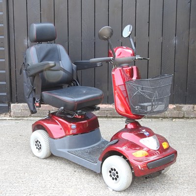 Lot 332 - A red TGA electric mobility scooter, with charger
