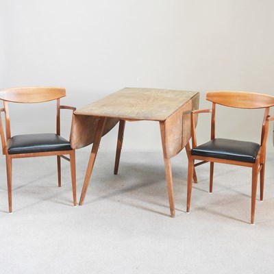 Lot 609 - A 1960s Ercol light elm drop leaf dining table...
