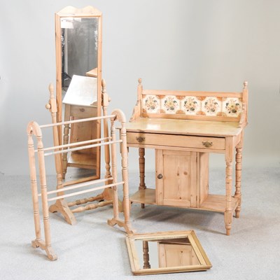 Lot 561 - An antique pine wash stand, with a tiled back,...