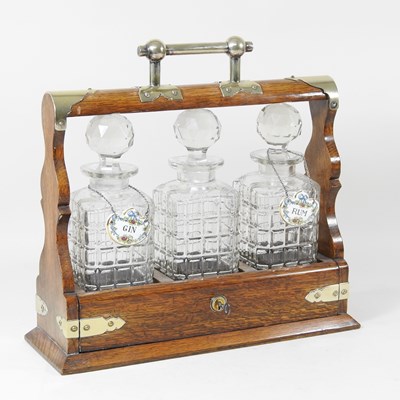 Lot 12 - An early 20th century oak and brass mounted...