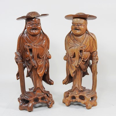 Lot 198 - A pair of Chinese carved wooden figures, early...