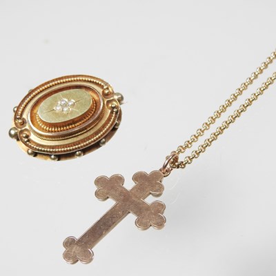 Lot 144 - A 9 carat gold cross pendant, suspended on a 9...