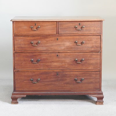 Lot 66 - A George III mahogany chest, on ogee bracket feet