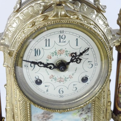 Lot 48 - An ornate French style three piece clock garniture