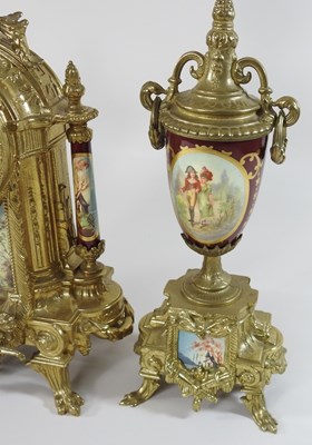 Lot 48 - An ornate French style three piece clock garniture