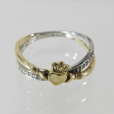 Lot 240 - A 10 carat gold and silver ladies dress ring,...