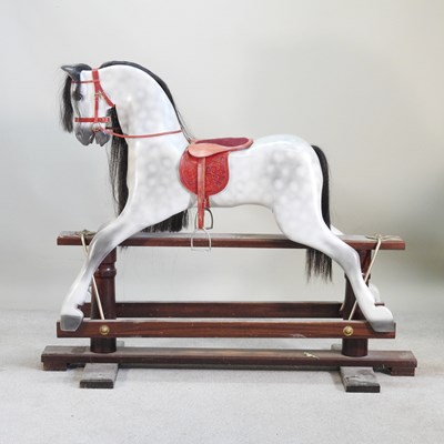 Lot 51 - A painted wooden dappled grey rocking horse,...