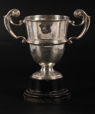 Lot 61 - A silver trophy, with scroll handles, engraved...