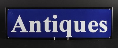 Lot 438 - An enamel on metal Antiques sign