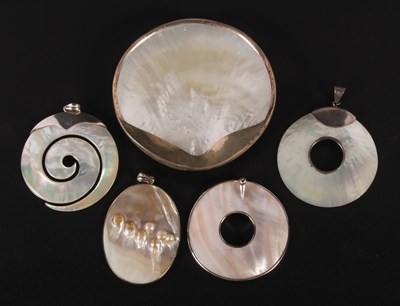 Lot 200 - Three silver-mounted mother-of-pearl pendants,...