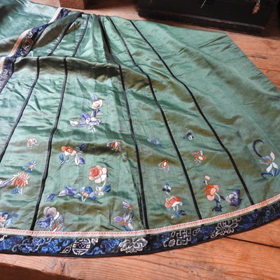 Lot 189 - A Chinese green silk richly embroidered skirt