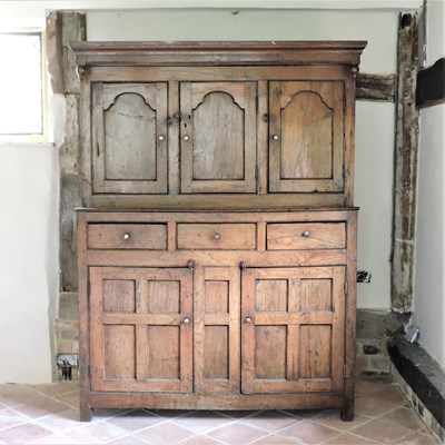 Lot 5 - An 18th century elm livery cupboard