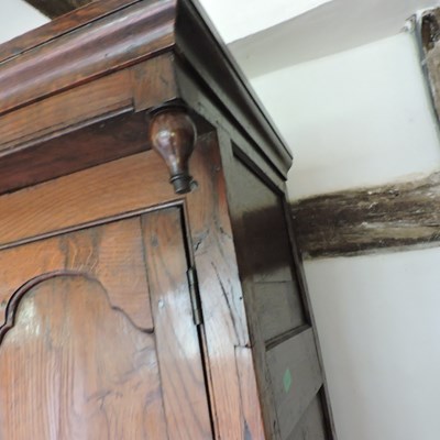 Lot 5 - An 18th century elm livery cupboard