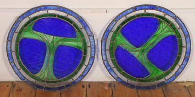 Lot 657 - A pair of blue and green stained glass roundels