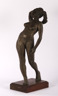 Lot 14 - A large bronzed resin figure of a woman, on a...