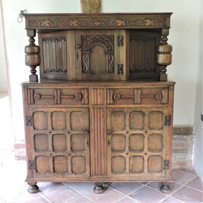 Lot 7 - An early 20th century carved oak court cupboard