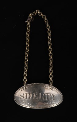 Lot 214 - A George III white metal decanter label for...