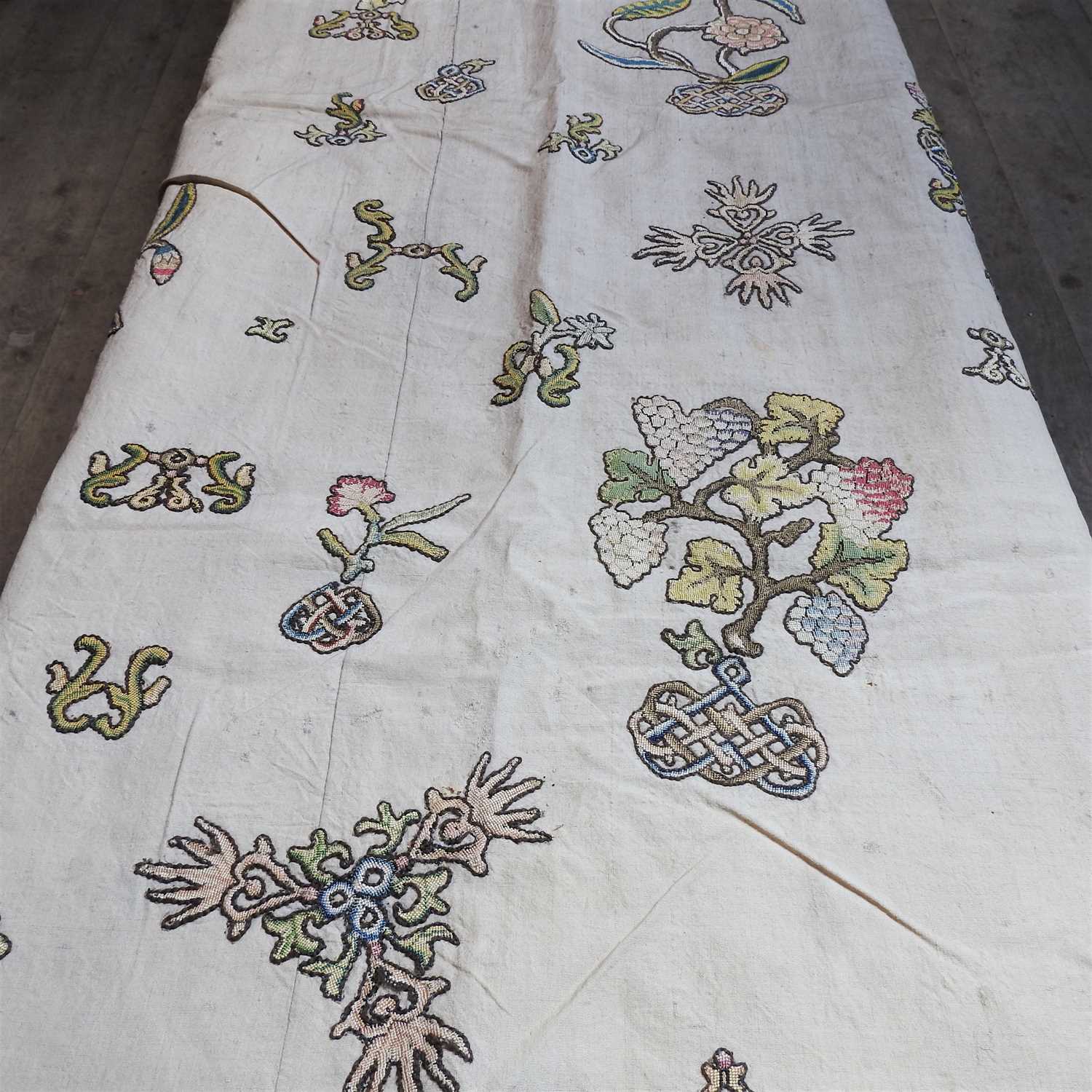 Lot 199 A pair of crewel work wall hangings