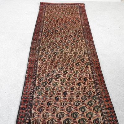 Lot 139 - A Persian runner, with all over designs, on a...