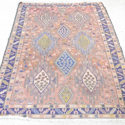Lot 363 - A Persian rug, with hooked medallions, on a...