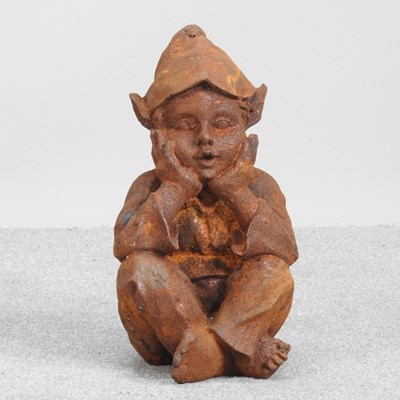 Lot 448 - A rusted garden statue of a seated goblin,...