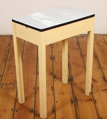 Lot 466 - A metamorphic enamel-topped side table, the...